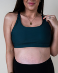 close up view of maternity nursing bra in dark green