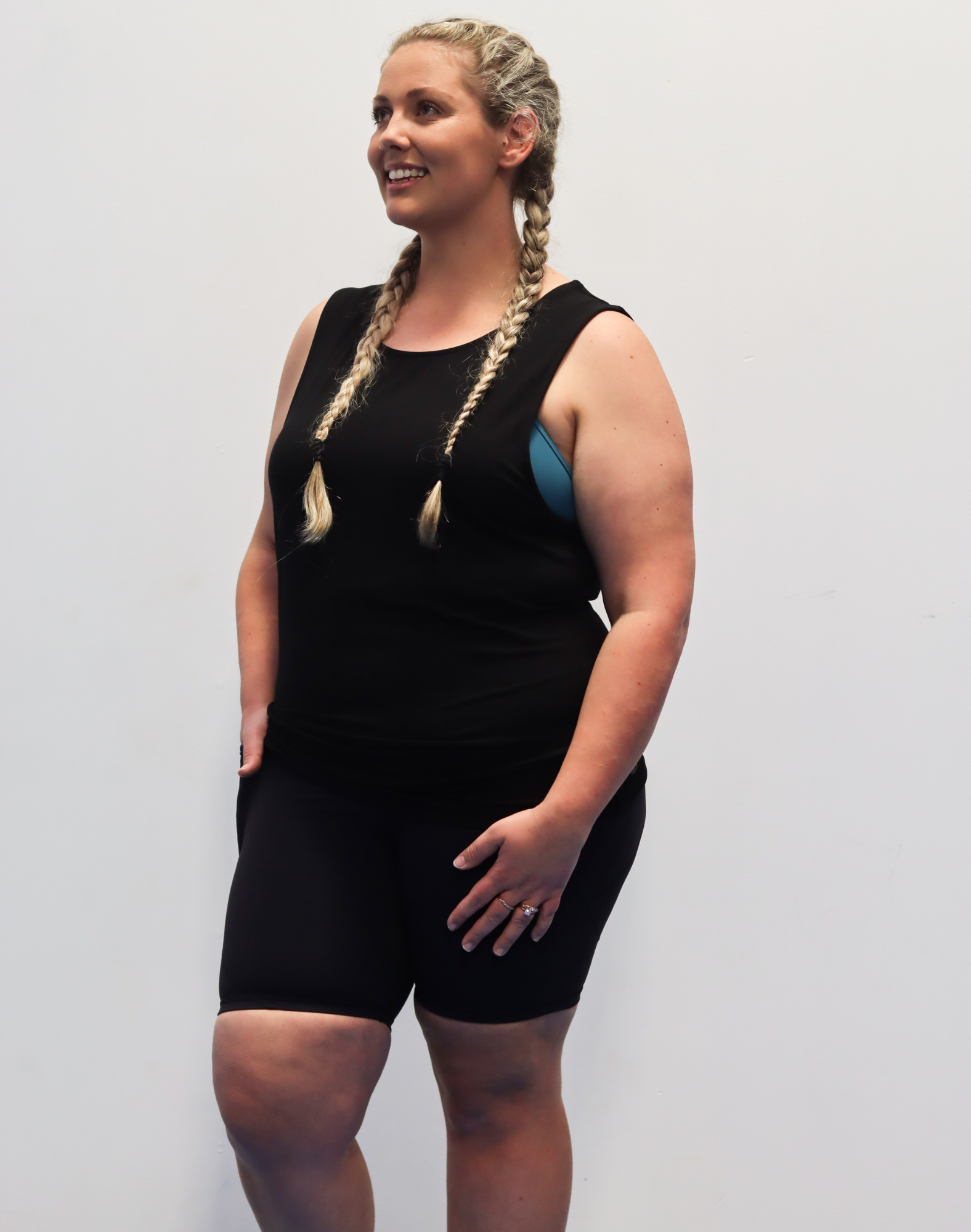 Active mother wearing high waisted maternity bikes shorts with pockets