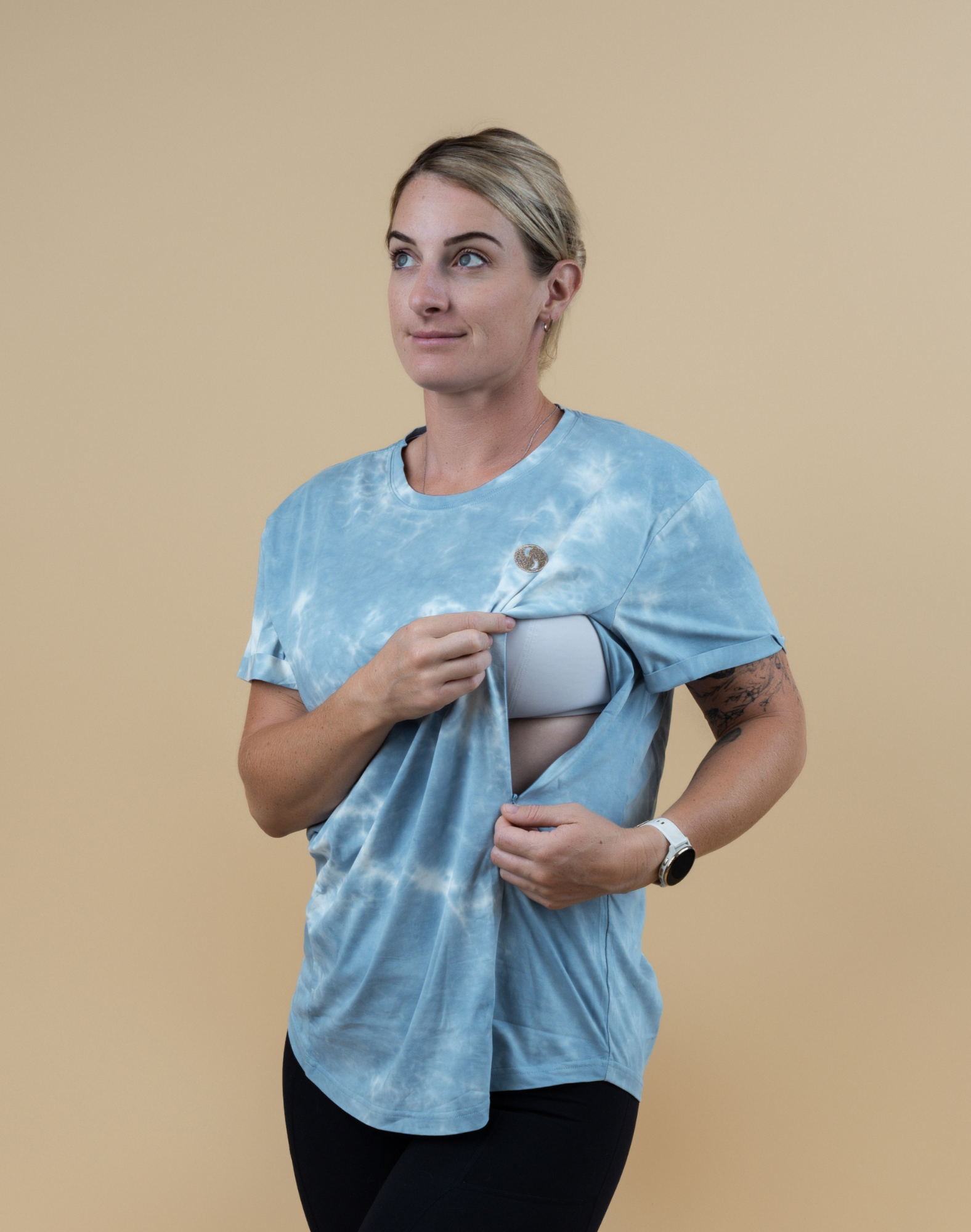 Breastfeeding mum demonstrating nursing functionality of Tie-dye breastfeeding Charlotte Tee