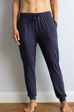 side view of a active mum wearing navy bamboo jogger pants
