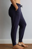 side view of a active mum wearing navy bamboo jogger pants