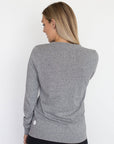 back view of a mum in a grey crew neck maternity top
