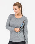 active mum wearing a grey crew neck maternity top with invisible zips unzipped to breastfeed