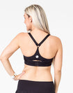back view of a mum wearing a black maternity activewear bra with a racerback