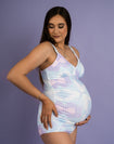 Pregnant mother holding bump wearing maternity swimwear set