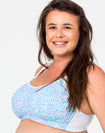 side on view of a happy mum wearing a confetti nursing sports bra