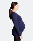 Side on view of pregnant women wearing a bamboo long sleeve top