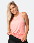 Happy, active mum wearing melon coloured tank