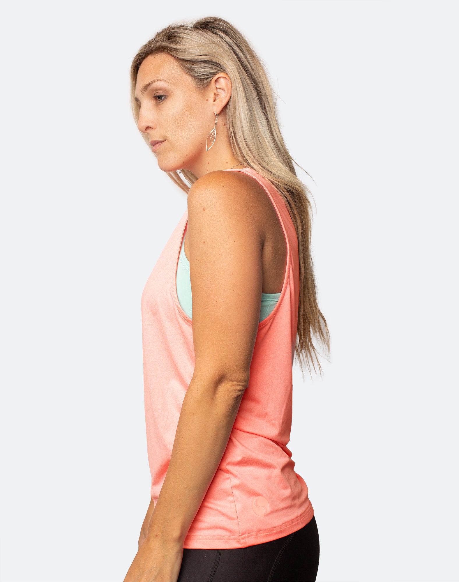 Side view of active mum wearing breastfeeding tank