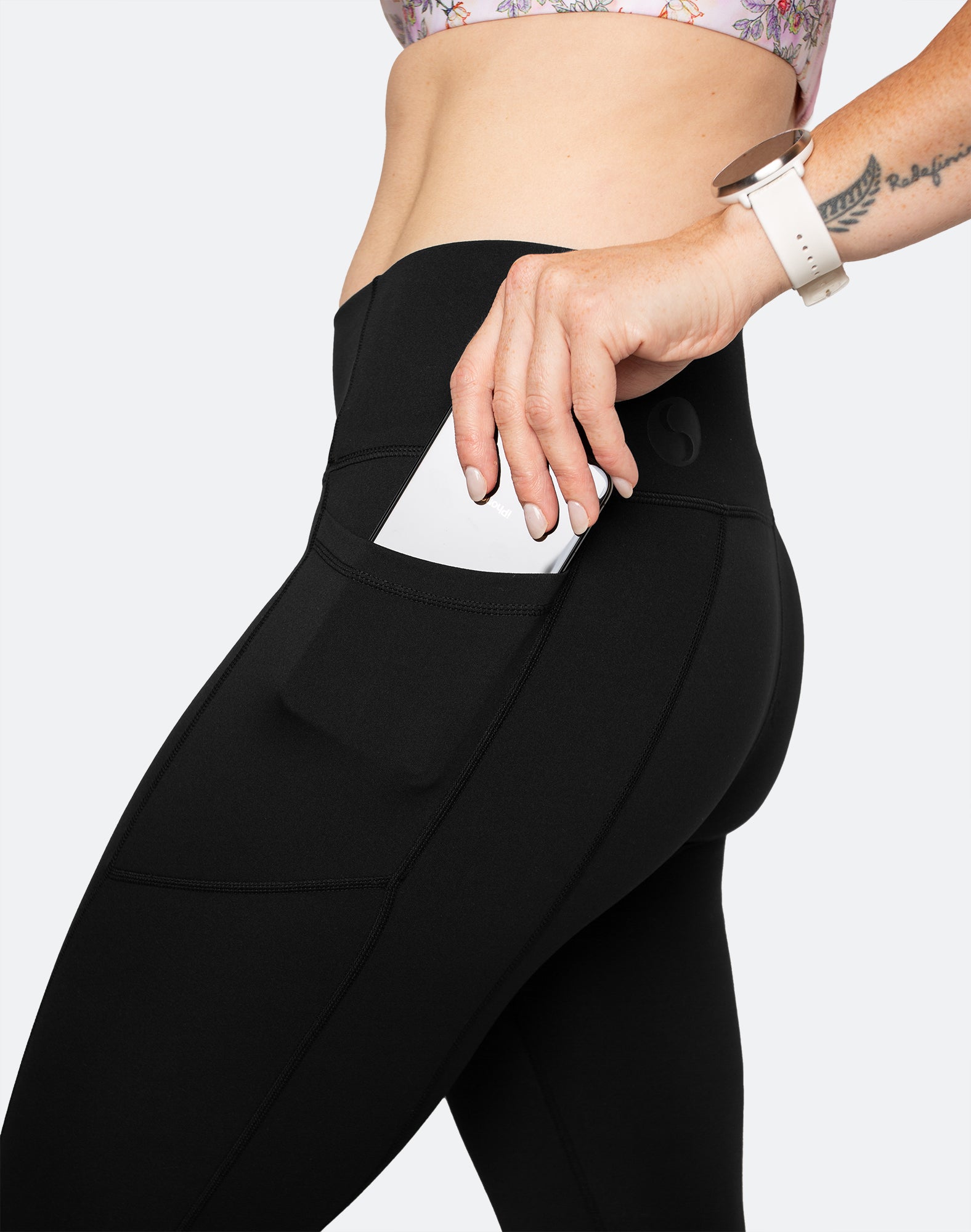 side view showing pockets can fit large phone in black post pregnancy supportive tights 